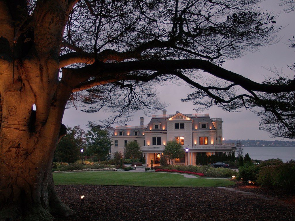 An external photo of The Chanler at Cliff Walk, Newport, Rhode Island with a large tree in the foreground