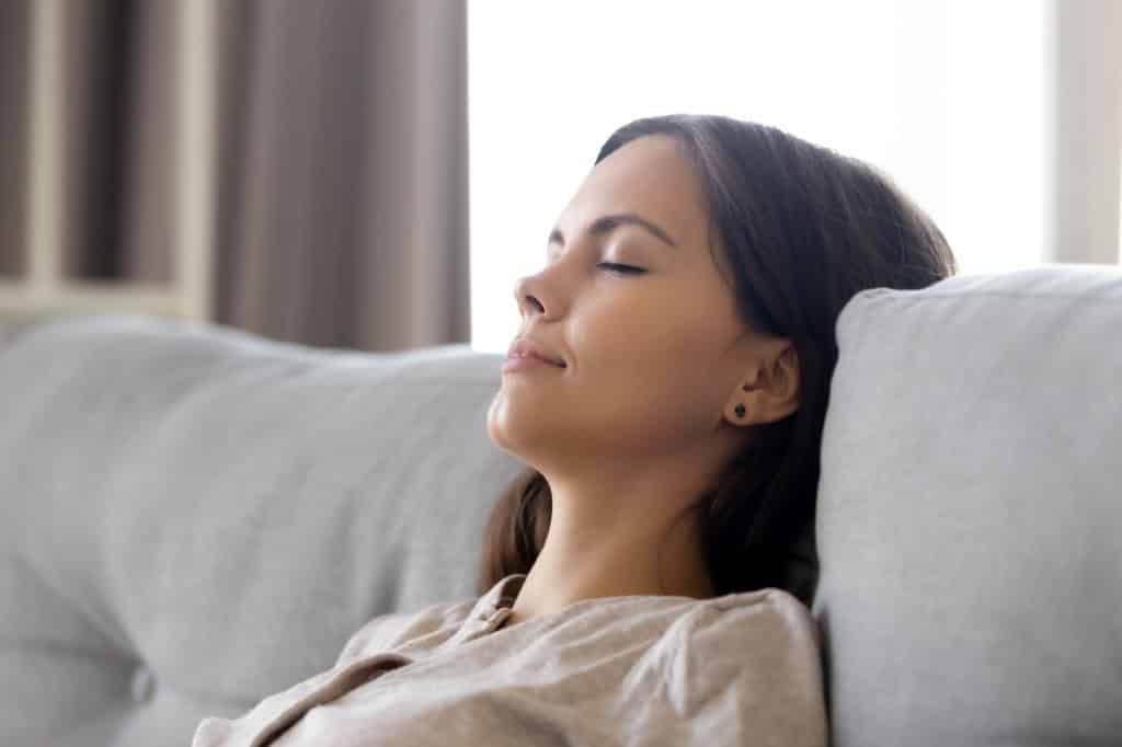 Woman napping on sofa