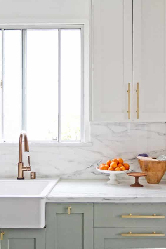 A marble kitchen and brass tap fixture