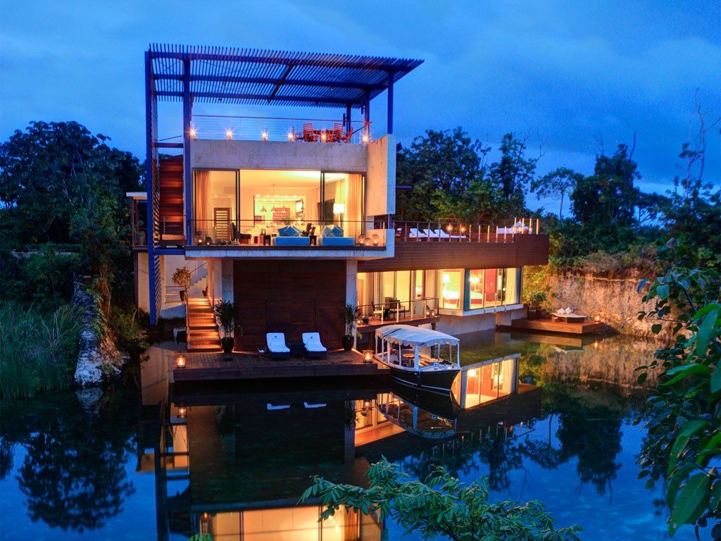 An external night shot of the villa resort Rosewood Mayakoba in Mexico